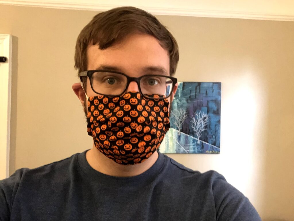 A picture of me in a pumpkin mask.