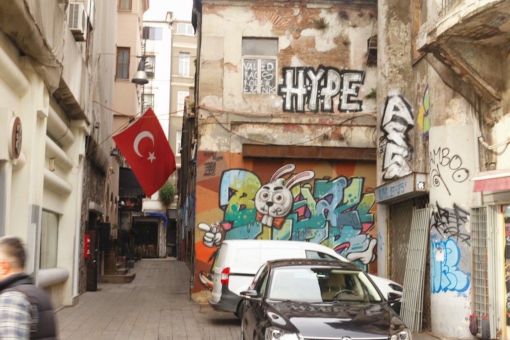 A street in Istanbul, there is graffiti on the wall that says HYPE